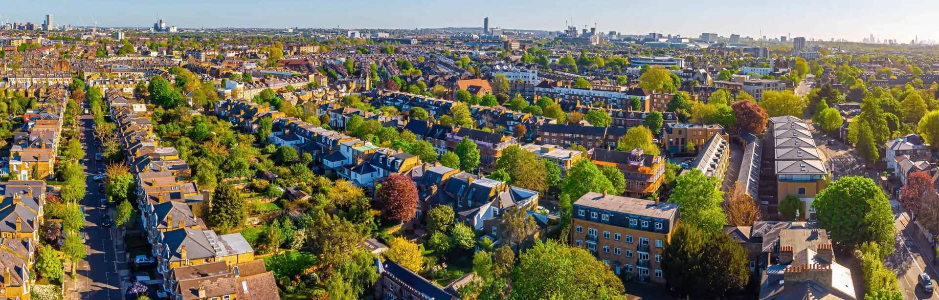 Aerial view of urban neighbourhood with trees and gardens used in a Biodiversity Net Gain (BNG) assessment and UKHab baseline survey