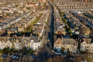 Aerial view of residential streets, junctions and terraced housing.