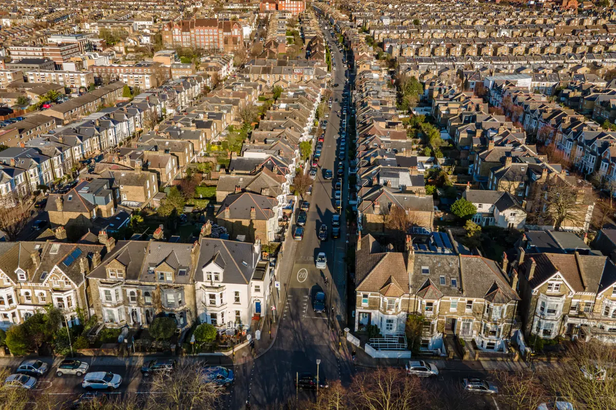 Aerial view of residential streets, junctions and terraced housing.